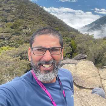 Brad smiling on a mountain trail